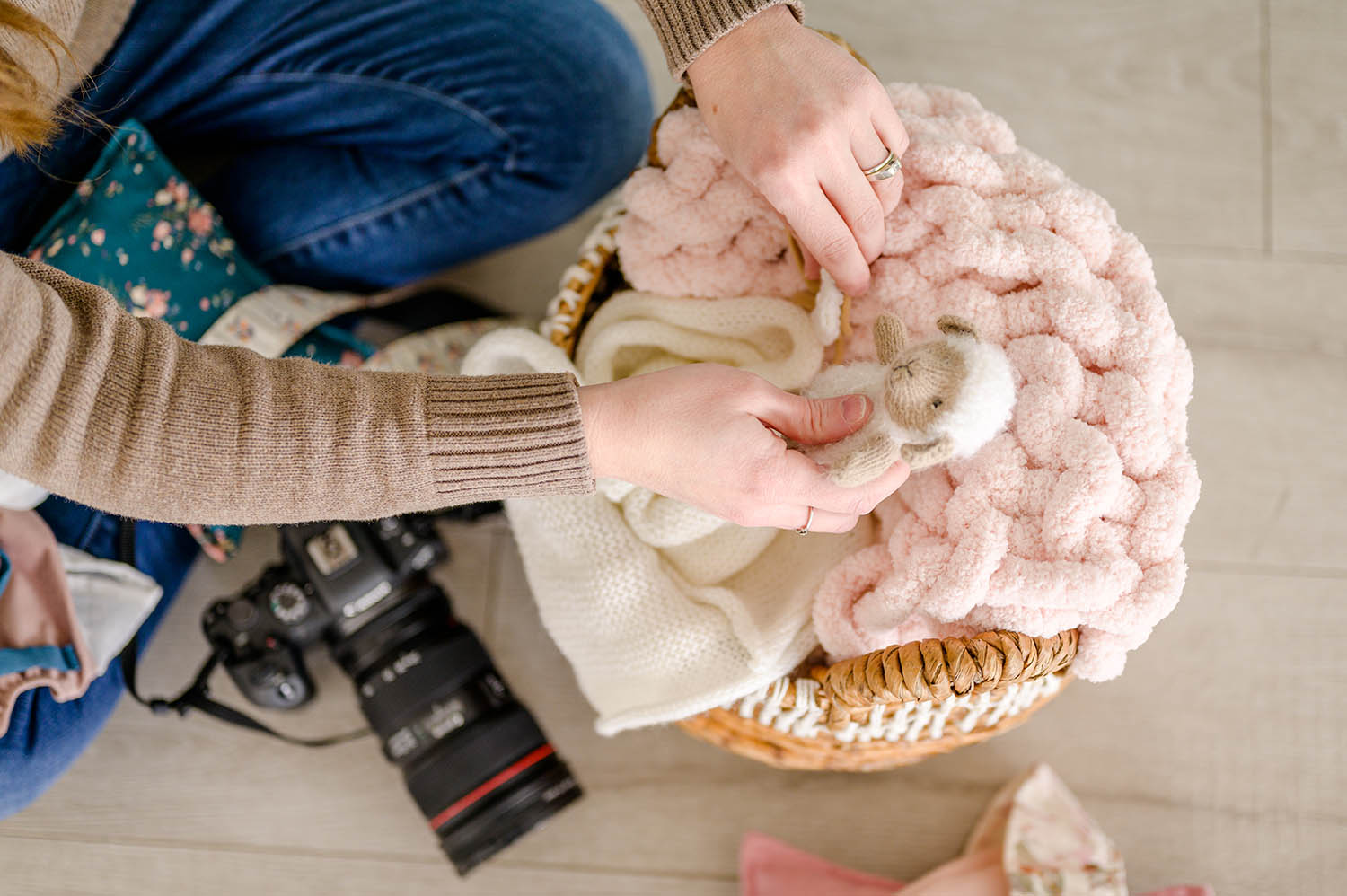 do you tip newborn photographers photographer putting little lamb in basket for a session